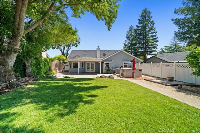 3014 California Park Dr, Chico, CA 95928 - rear view of house featuring a hot tub, a patio area, a chimney, stucco siding, and french doors