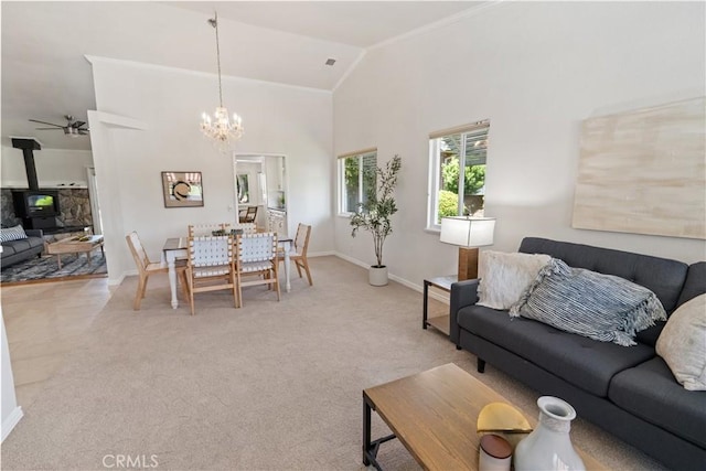 3014 California Park Dr, Chico, CA 95928 - living area with a chandelier, a wood stove, crown molding, light carpet, and a ceiling fan