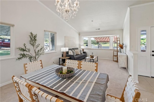 3014 California Park Dr, Chico, CA 95928 - dining area featuring a chandelier, light carpet, crown molding, and high vaulted ceiling