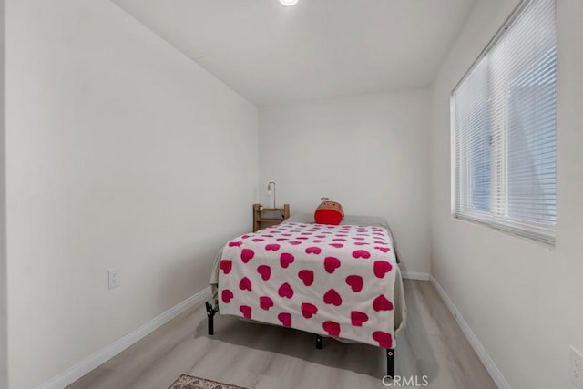 7701 Baird Ave, Reseda, CA 91335 - bedroom with wood finished floors and baseboards