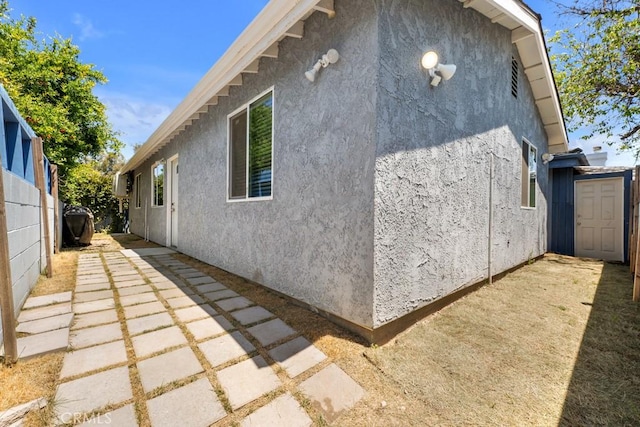 7701 Baird Ave, Reseda, CA 91335 - view of property exterior featuring stucco siding and a patio