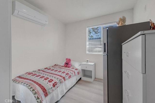 7701 Baird Ave, Reseda, CA 91335 - bedroom featuring a wall mounted air conditioner and light wood finished floors