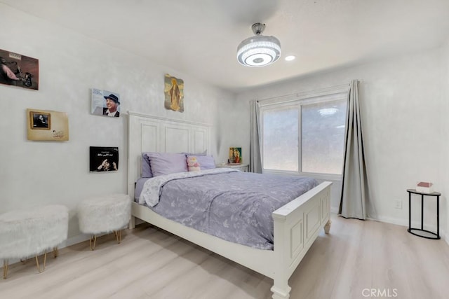 7701 Baird Ave, Reseda, CA 91335 - bedroom with light wood-style flooring and baseboards