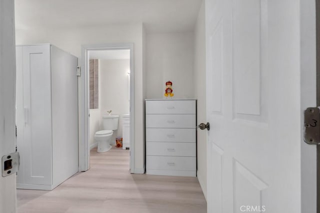 7701 Baird Ave, Reseda, CA 91335 - bathroom with wood finished floors and toilet