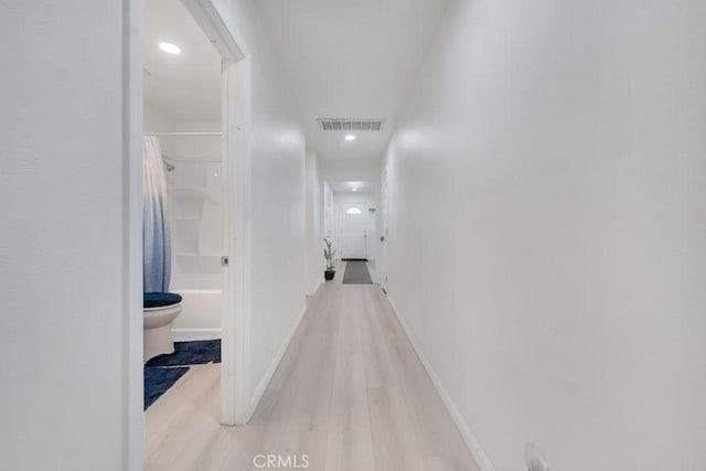 7701 Baird Ave, Reseda, CA 91335 - hallway with light wood-style floors, recessed lighting, and baseboards