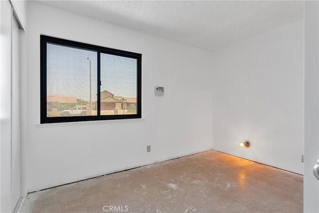 9820 Mandalay Ct, Riverside, CA 92503 - spare room with concrete flooring and a textured ceiling