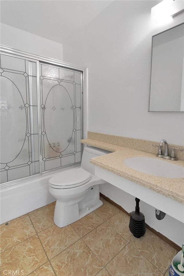 9820 Mandalay Ct, Riverside, CA 92503 - bathroom featuring combined bath / shower with glass door, toilet, and vanity