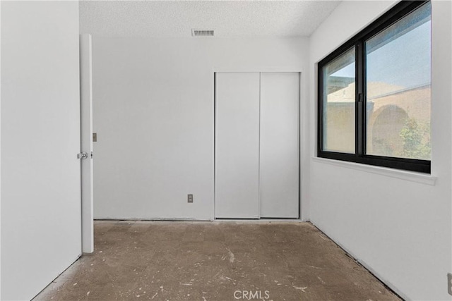 9820 Mandalay Ct, Riverside, CA 92503 - unfurnished bedroom with a textured ceiling and a closet