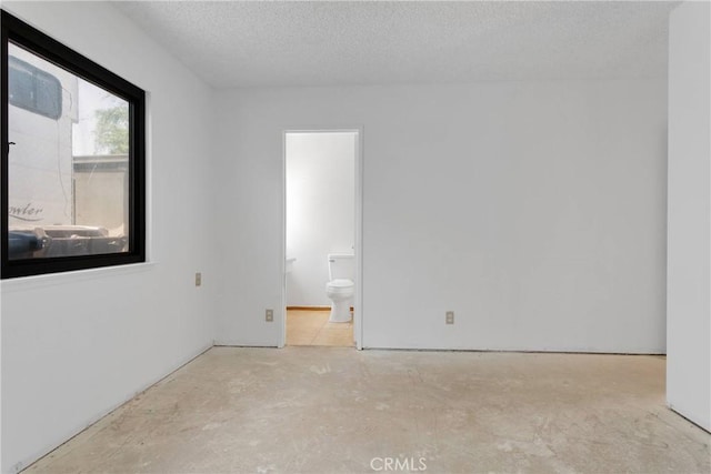 9820 Mandalay Ct, Riverside, CA 92503 - unfurnished room with unfinished concrete floors and a textured ceiling