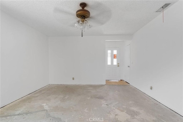 9820 Mandalay Ct, Riverside, CA 92503 - spare room with unfinished concrete flooring, a textured ceiling, and a ceiling fan