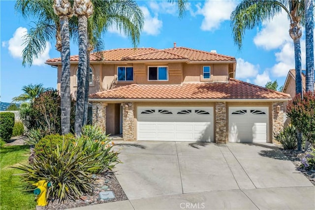 32070 Corte Bonilio, Temecula, CA 92592 - mediterranean / spanish-style home with a tiled roof, driveway, stone siding, and stucco siding