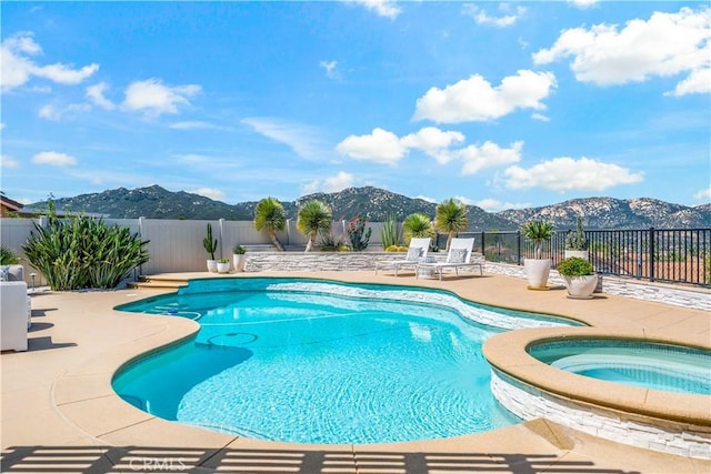 32070 Corte Bonilio, Temecula, CA 92592 - view of swimming pool featuring a mountain view, a fenced backyard, an in-ground hot tub, and a patio area