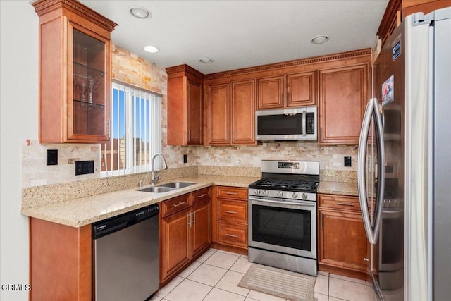 849 Plaza Cuernavaca Way, San Diego, CA 92114 - kitchen featuring stainless steel appliances, brown cabinetry, backsplash, and recessed lighting