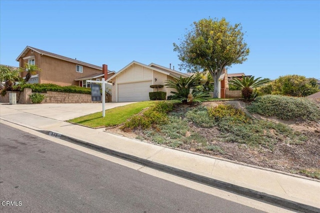 849 Plaza Cuernavaca Way, San Diego, CA 92114 - view of front of house with stucco siding, an attached garage, and concrete driveway