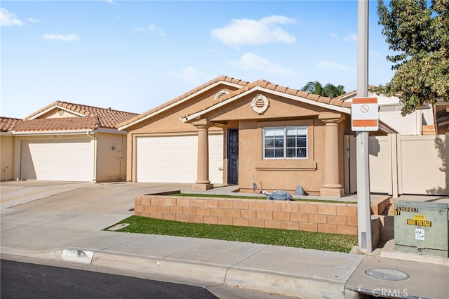 28162 Bavaria Dr, Menifee, CA 92585 - mediterranean / spanish-style house featuring a tiled roof, stucco siding, an attached garage, and driveway