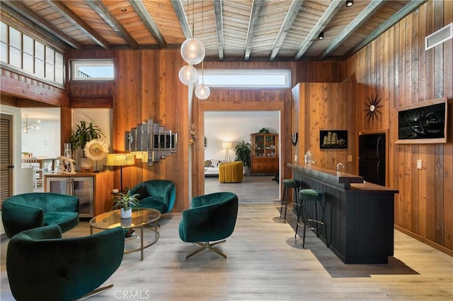 33252 Big Sur St, Dana Point, CA 92629 - living area featuring wood walls, a wooden ceiling with exposed beams, a high ceiling, bar area, and wood finished floors