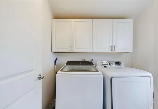 23308 Friar St, Woodland Hills, CA 91367 - laundry room featuring cabinet space and washer and dryer