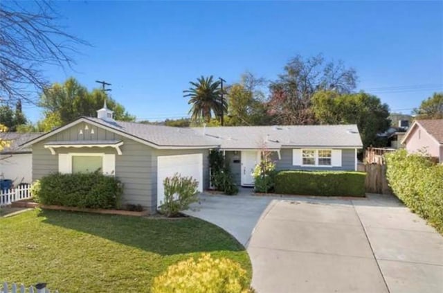 23308 Friar St, Woodland Hills, CA 91367 - ranch-style home featuring concrete driveway, a garage, and board and batten siding