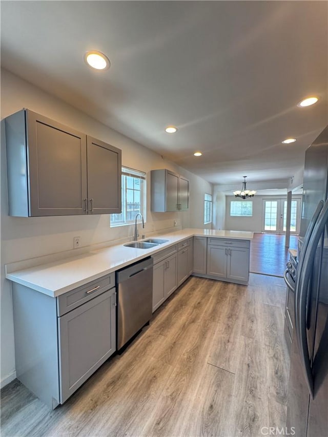 23308 Friar St, Woodland Hills, CA 91367 - kitchen with dishwasher, gray cabinetry, a chandelier, light wood-style floors, and a peninsula