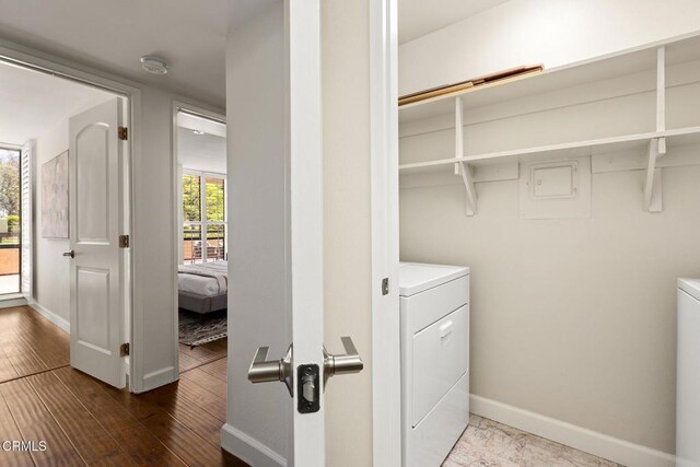 4000 Via Marisol 103, Los Angeles, CA 90042 - laundry area with wood finished floors and independent washer and dryer