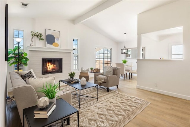 4519 Darien St, Torrance, CA 90503 - living area with wood finished floors, a glass covered fireplace, and a chandelier