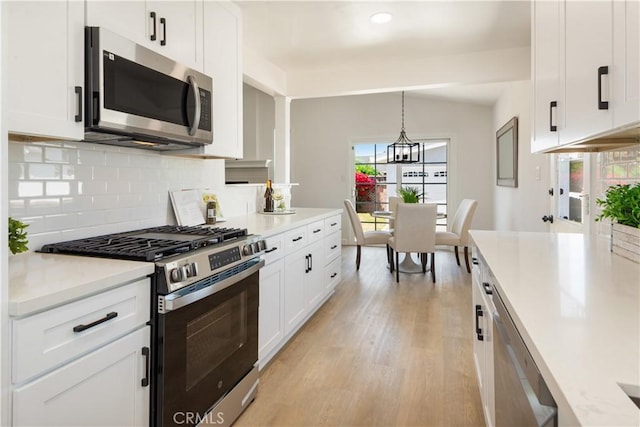 4519 Darien St, Torrance, CA 90503 - kitchen with stainless steel appliances, light wood-style floors, decorative backsplash, light countertops, and recessed lighting