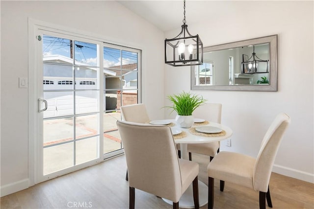 4519 Darien St, Torrance, CA 90503 - dining area featuring a chandelier, wood finished floors, and vaulted ceiling