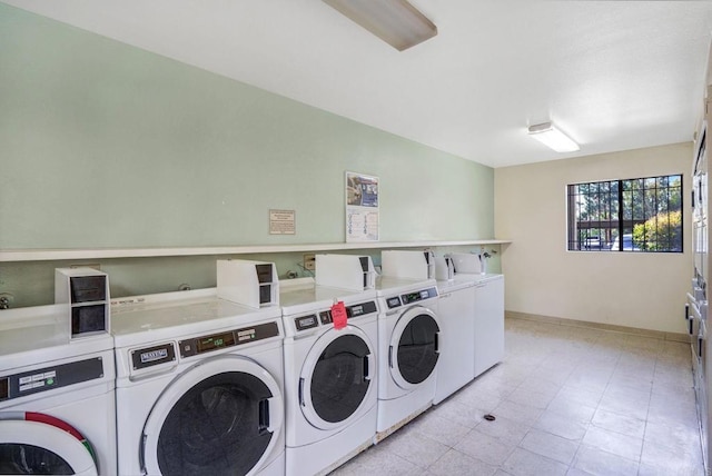 10296 Black Mountain Rd Unit 222, San Diego, CA 92126 - community laundry featuring washer and dryer, stacked washer and clothes dryer, and baseboards
