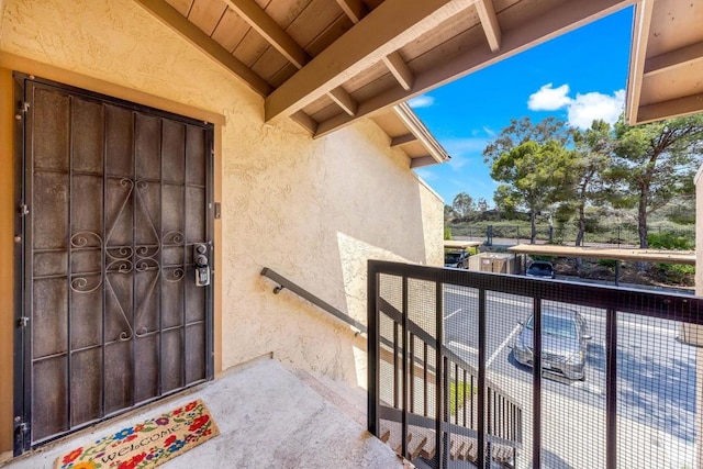 10296 Black Mountain Rd Unit 222, San Diego, CA 92126 - doorway to property with stucco siding and a balcony