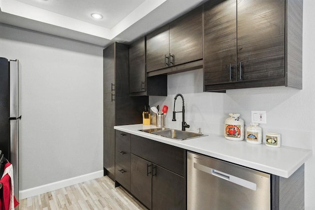 10296 Black Mountain Rd Unit 222, San Diego, CA 92126 - kitchen featuring stainless steel appliances, a sink, baseboards, light countertops, and light wood finished floors