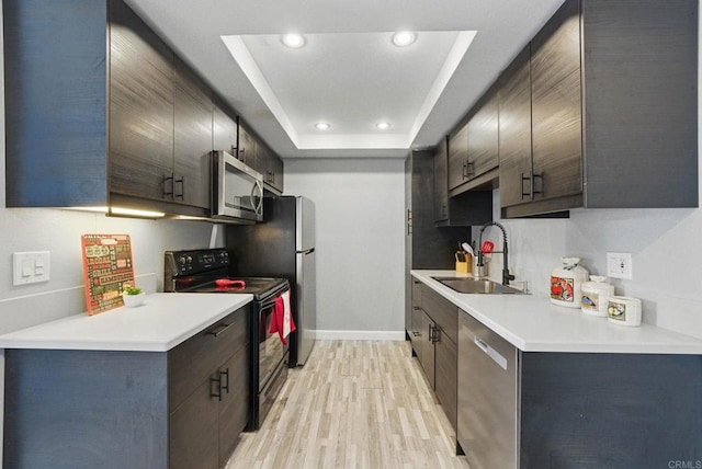 10296 Black Mountain Rd Unit 222, San Diego, CA 92126 - kitchen with stainless steel appliances, a sink, light wood finished floors, recessed lighting, and baseboards