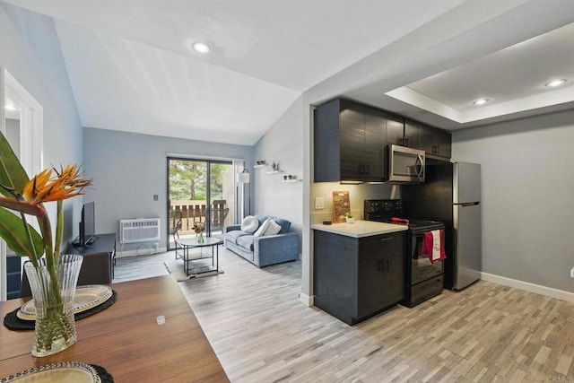 10296 Black Mountain Rd Unit 222, San Diego, CA 92126 - kitchen with stainless steel appliances, light wood finished floors, light countertops, baseboards, and a wall unit AC