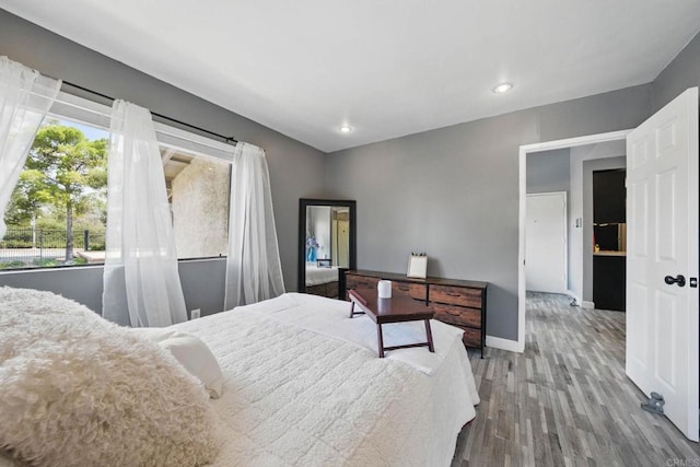 10296 Black Mountain Rd Unit 222, San Diego, CA 92126 - bedroom featuring wood finished floors, baseboards, and recessed lighting