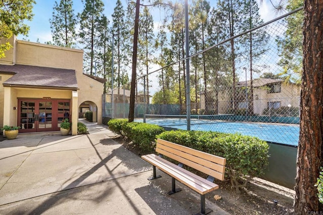 10296 Black Mountain Rd Unit 222, San Diego, CA 92126 - view of home's community featuring a tennis court, an attached garage, and concrete driveway