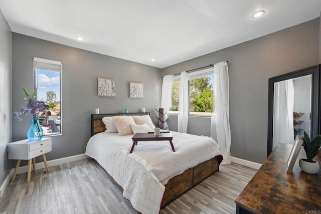 10296 Black Mountain Rd Unit 222, San Diego, CA 92126 - bedroom featuring baseboards, light wood-style flooring, and recessed lighting