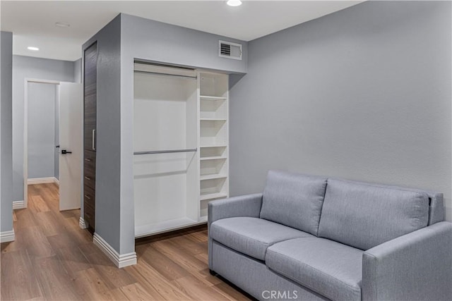 5460 White Oak Ave Unit H106, Encino, CA 91316 - living area with wood finished floors, baseboards, and recessed lighting
