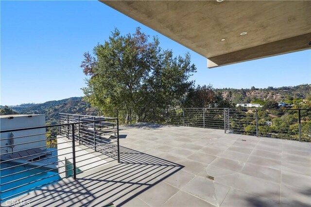 9716 Oak Pass Rd, Beverly Hills, CA 90210 - view of patio featuring a balcony