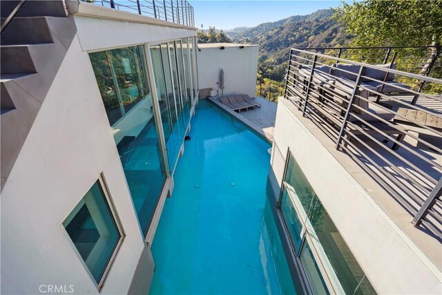 9716 Oak Pass Rd, Beverly Hills, CA 90210 - view of swimming pool featuring a mountain view