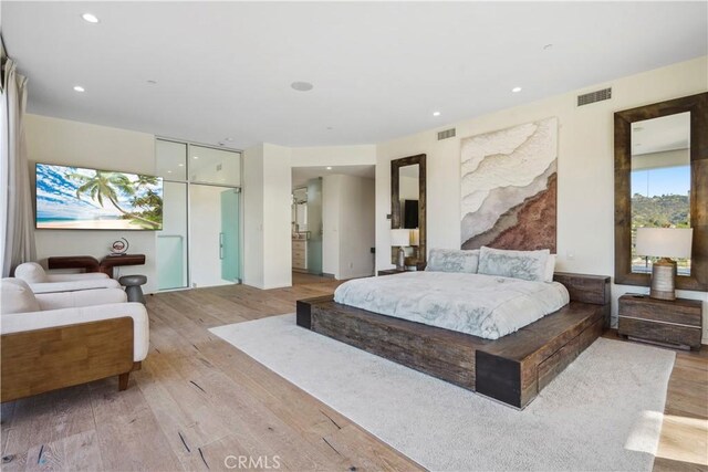 9716 Oak Pass Rd, Beverly Hills, CA 90210 - bedroom featuring light wood-type flooring and recessed lighting