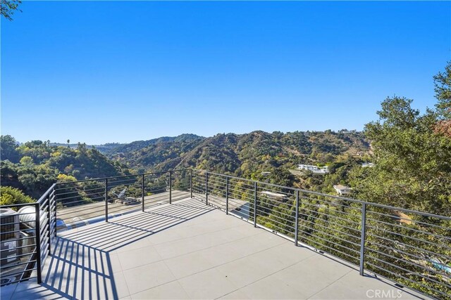 9716 Oak Pass Rd, Beverly Hills, CA 90210 - view of patio featuring a mountain view and a balcony