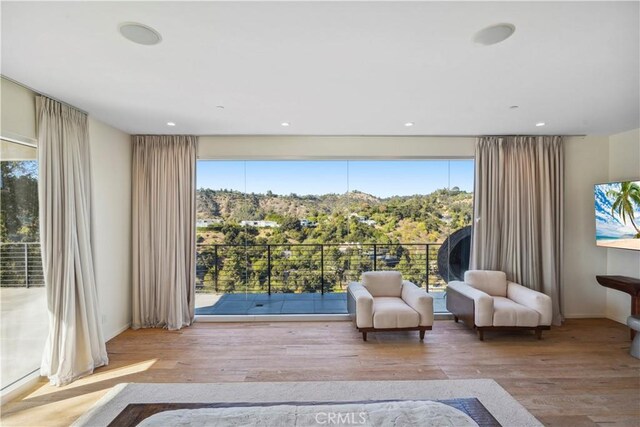 9716 Oak Pass Rd, Beverly Hills, CA 90210 - living area featuring wood finished floors, healthy amount of natural light, baseboards, and recessed lighting