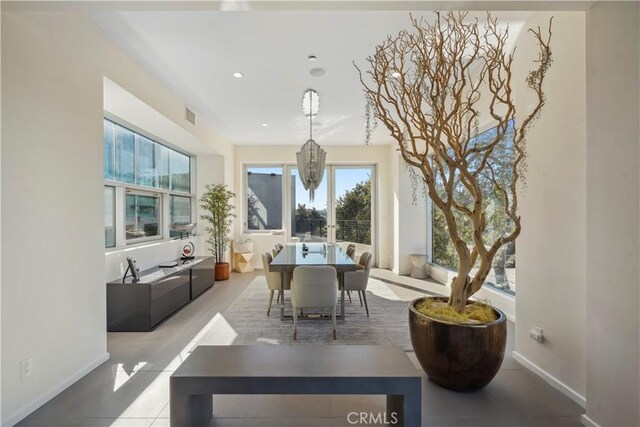 9716 Oak Pass Rd, Beverly Hills, CA 90210 - dining room featuring healthy amount of natural light, baseboards, a chandelier, and recessed lighting