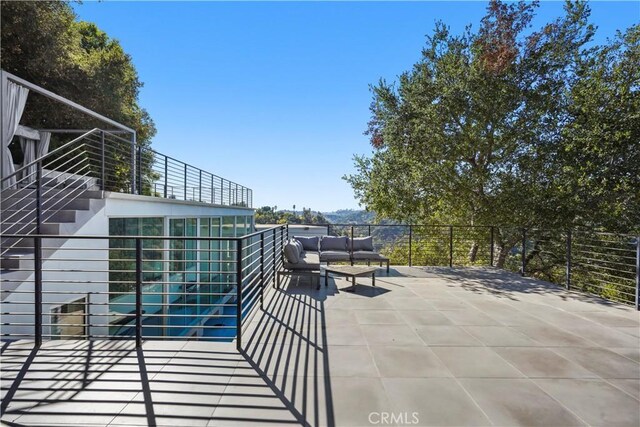 9716 Oak Pass Rd, Beverly Hills, CA 90210 - view of patio with stairway, outdoor lounge area, and a balcony