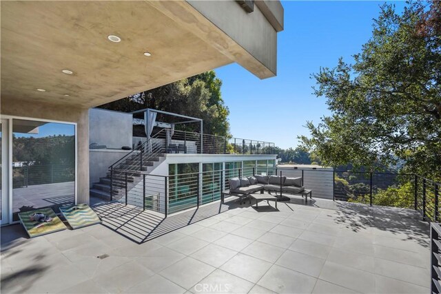 9716 Oak Pass Rd, Beverly Hills, CA 90210 - view of patio / terrace featuring outdoor lounge area, stairs, and a balcony