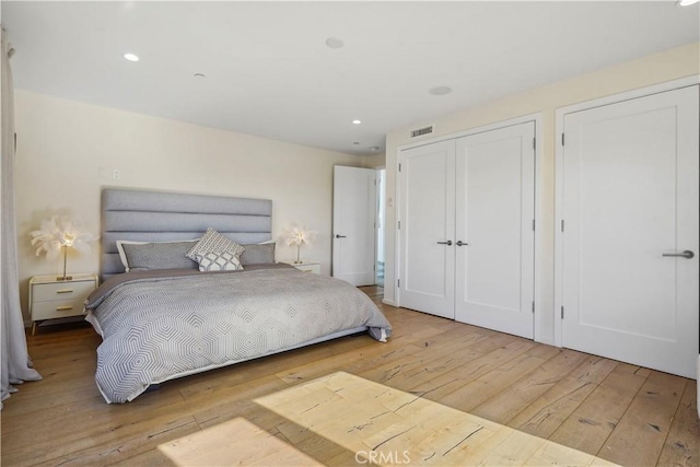 9716 Oak Pass Rd, Beverly Hills, CA 90210 - bedroom with wood-type flooring and recessed lighting