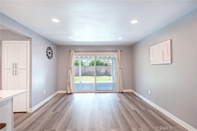 3624 Ardilla Ave, Baldwin Park, CA 91706 - unfurnished dining area featuring baseboards, light wood-type flooring, and recessed lighting