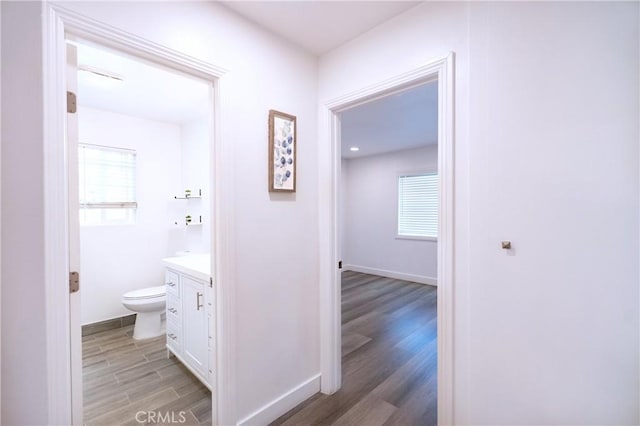 3624 Ardilla Ave, Baldwin Park, CA 91706 - hallway featuring light wood-style flooring, healthy amount of natural light, and baseboards