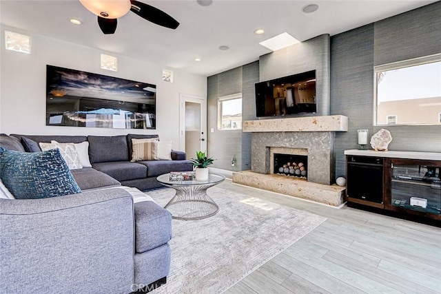 417 23rd St, Manhattan Beach, CA 90266 - living room with light wood-style floors, ceiling fan, a high end fireplace, and recessed lighting