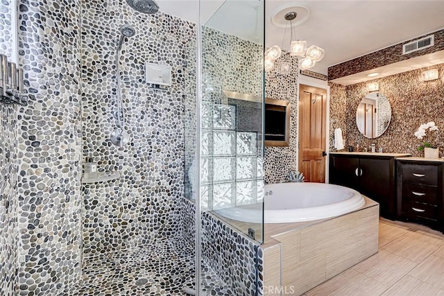 417 23rd St, Manhattan Beach, CA 90266 - bathroom featuring a shower stall, vanity, a bath, and a chandelier