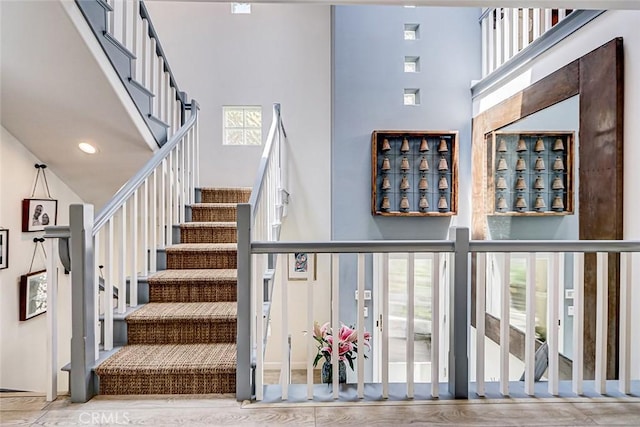 417 23rd St, Manhattan Beach, CA 90266 - stairs with a towering ceiling, healthy amount of natural light, and wood finished floors